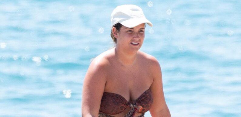 Jacqueline Jossa puts on a cheeky display in a strapless swimsuit