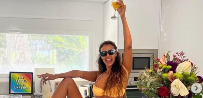 Maya Jama showcases her figure in a yellow string bikini in Ibiza