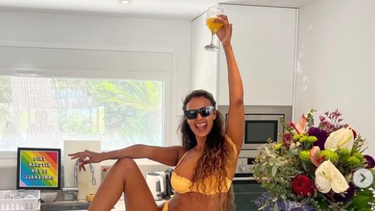 Maya Jama showcases her figure in a yellow string bikini in Ibiza