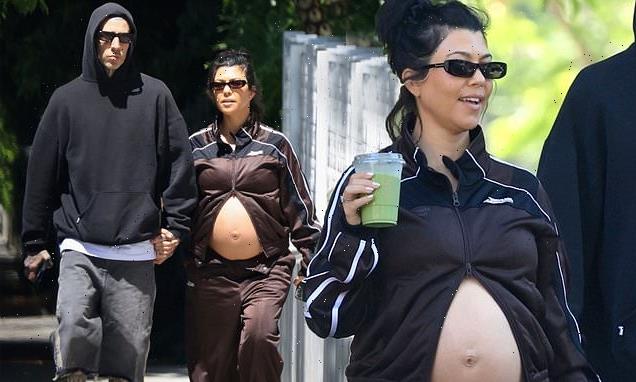 Pregnant Kourtney Kardashian proudly displays her bare baby bump