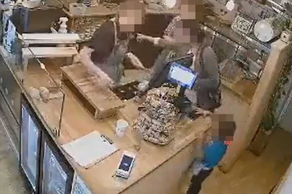 Shocking moment child swipes phone from shop counter as woman ‘scams’ change out of till | The Sun