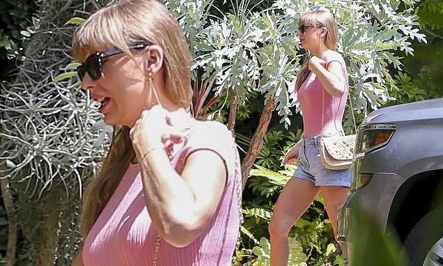 Taylor Swift models Barbie pink in