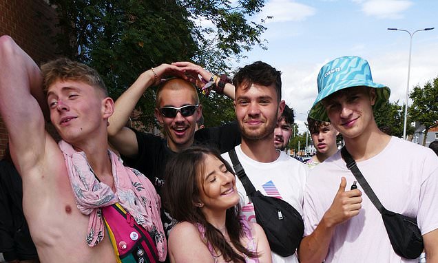 Welcome to Reading! Revellers arrive lugging backpacks and camping kit