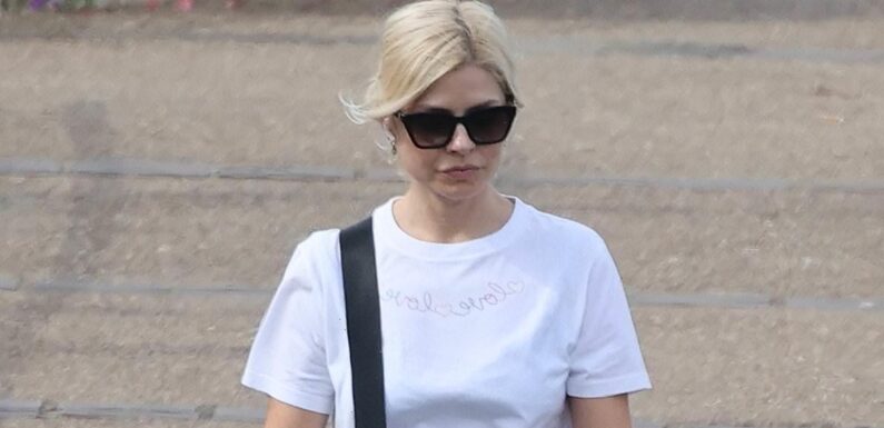 Holly Willoughby dons leggy denim shorts for a dog walk