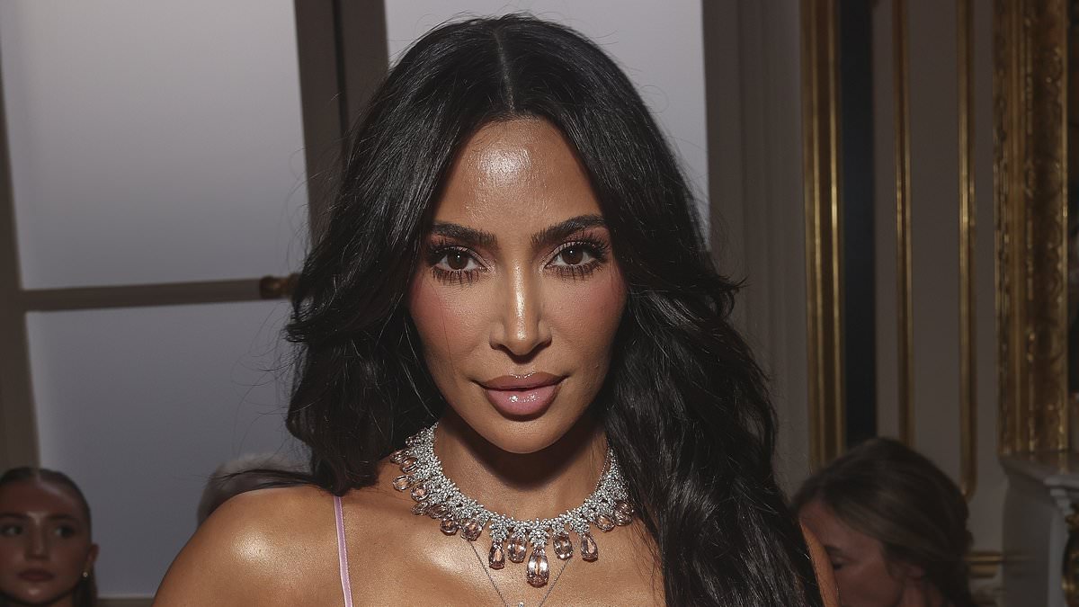 Kim Kardashian wears a silk gown at Victoria Beckham's PFW show