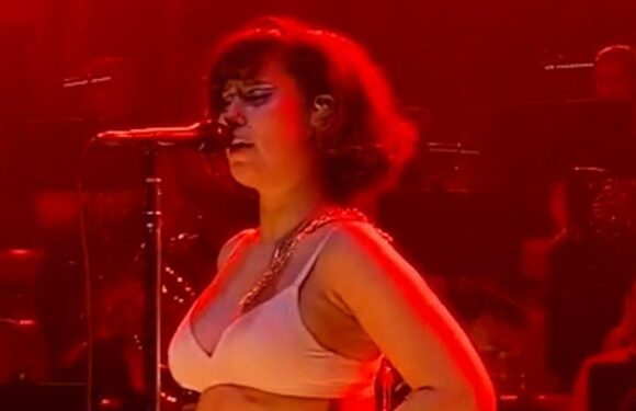 Raye strips down to her underwear in body dysmorphia statement