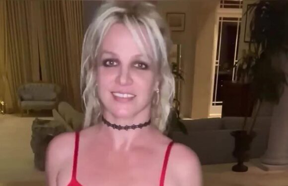 Britney Spears dances around in a sheer red dress amid legal drama