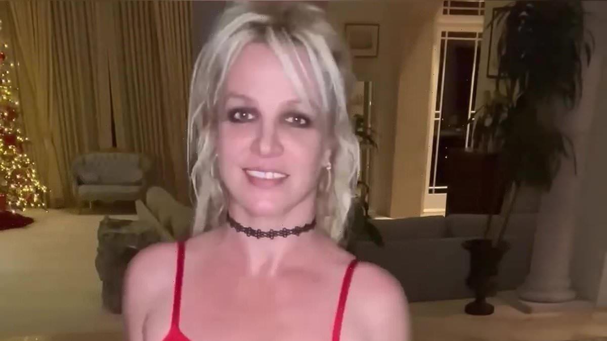 Britney Spears dances around in a sheer red dress amid legal drama