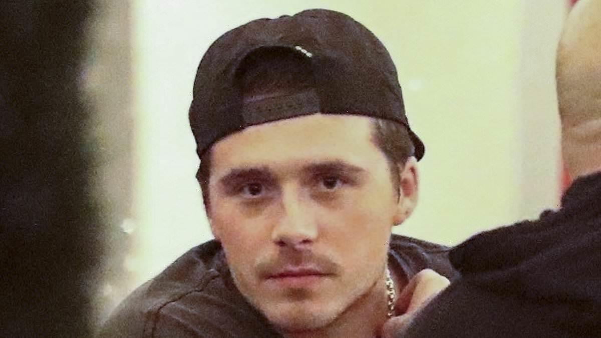 Brooklyn Beckham grabs a beer with a friend at Japanese restaurant
