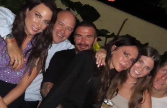 David Beckham can't keep his hands off his wife Victoria