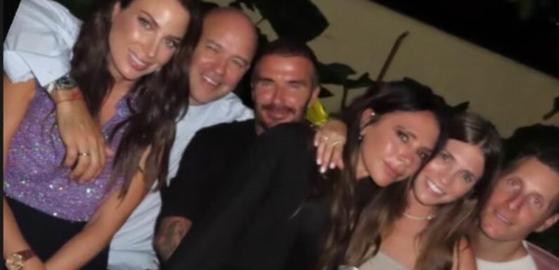 David Beckham can't keep his hands off his wife Victoria