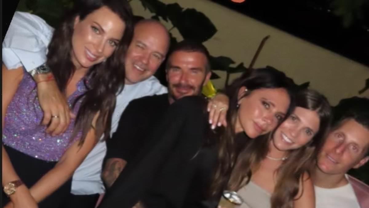 David Beckham can't keep his hands off his wife Victoria