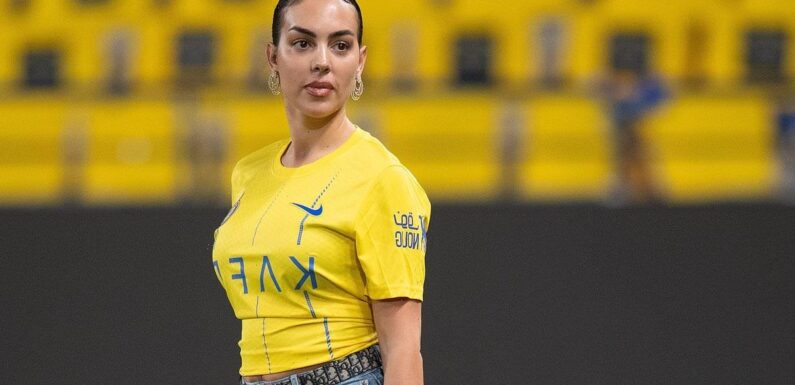 Georgina Rodriguez walks onto the pitch with her £115,000 Birkin bag