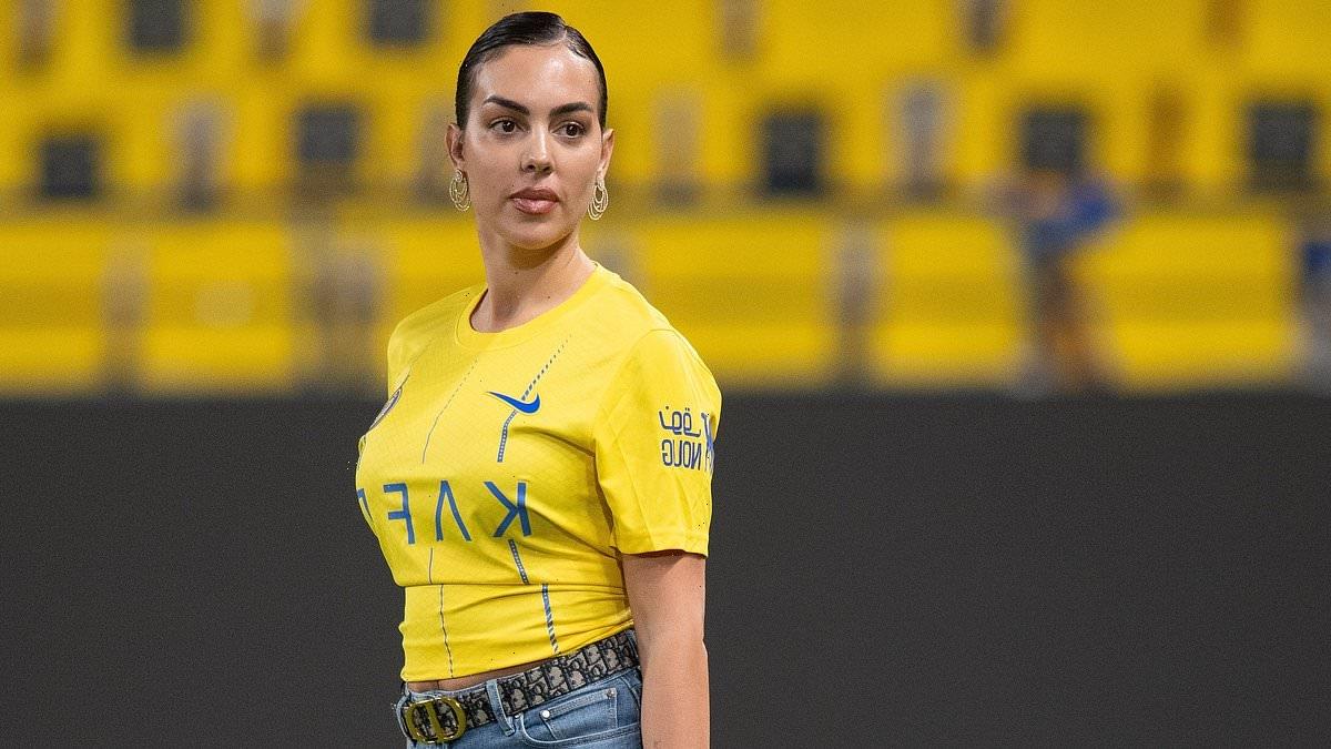 Georgina Rodriguez walks onto the pitch with her £115,000 Birkin bag