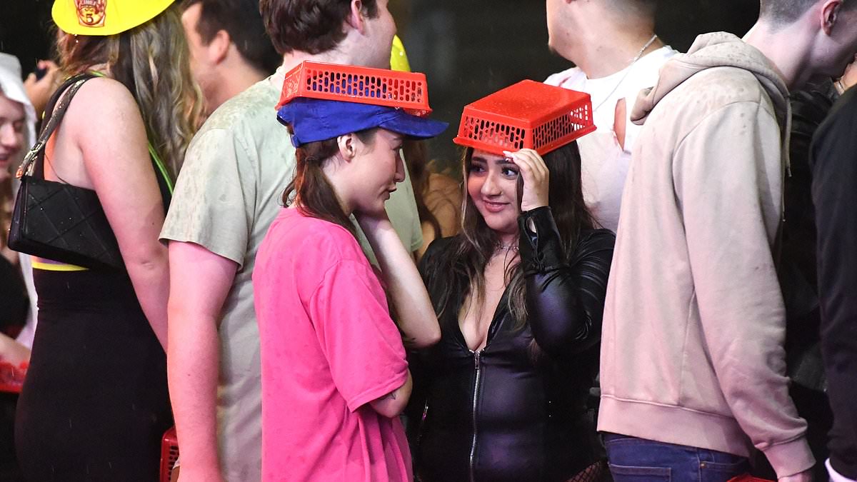 Halloween revellers hit Manchester's pubs as they celebrate in rain