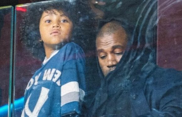 Kanye West and son Saint take in the Genoa vs AC Milan soccer game