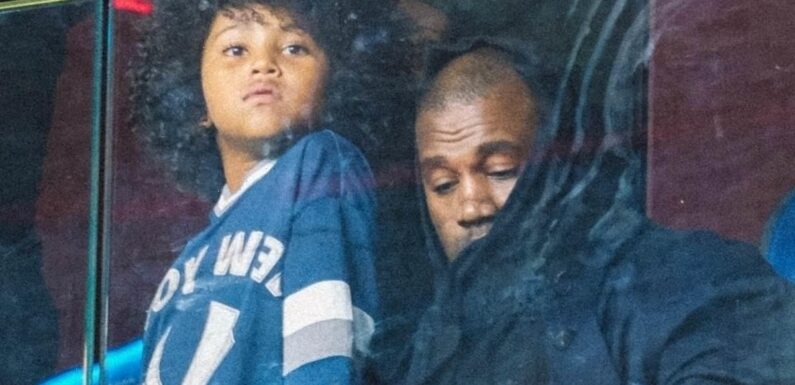 Kanye West and son Saint take in the Genoa vs AC Milan soccer game