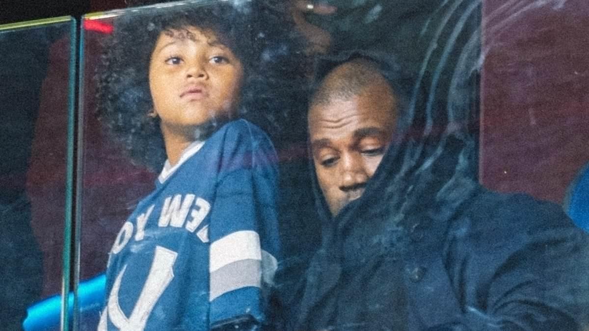 Kanye West and son Saint take in the Genoa vs AC Milan soccer game