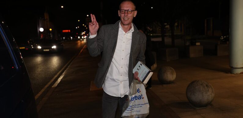 Laurence Fox holds book about GULAGS after release from custody