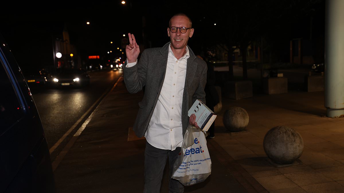 Laurence Fox holds book about GULAGS after release from custody