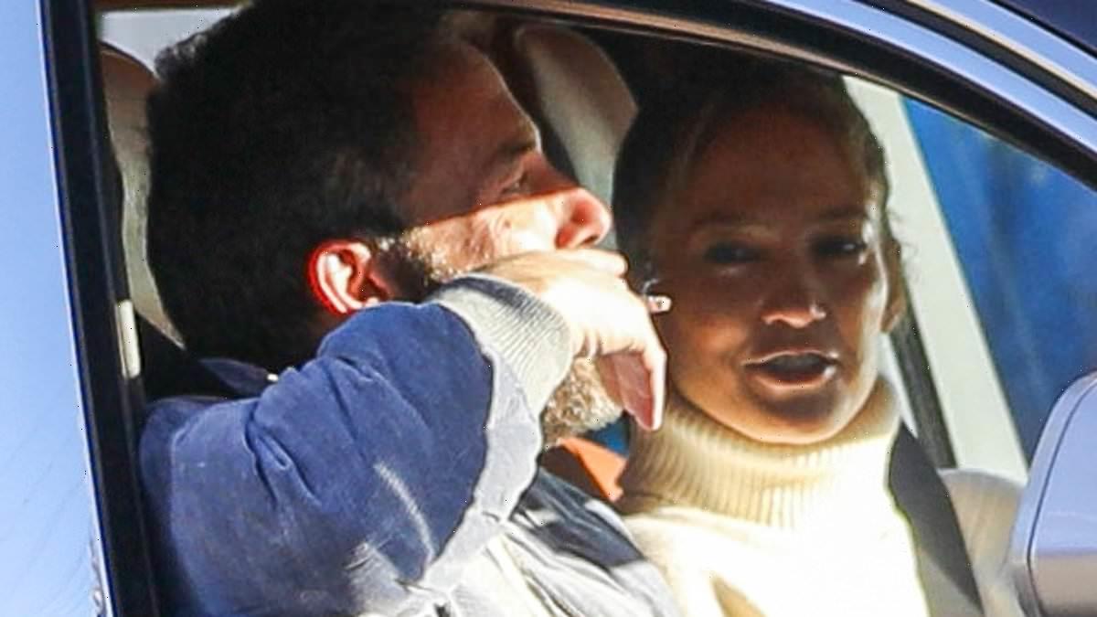 Ben Affleck puffs on a cigarette while driving wife Jennifer Lopez