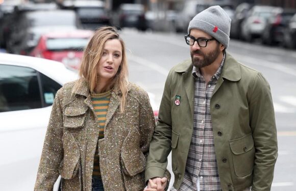Blake Lively and Ryan Reynolds hold hands on a walk