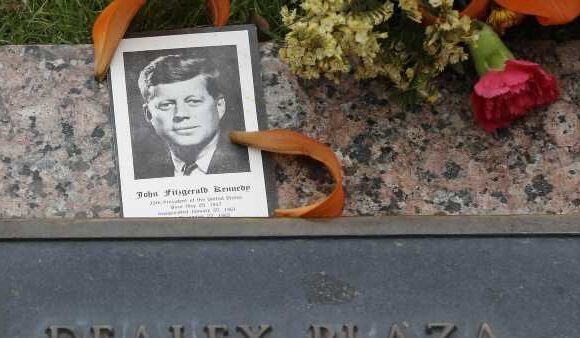 Mourners gather in Dealey Plaza to mark JFK assassination 60th