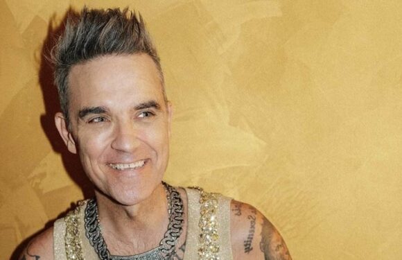 Robbie Williams claims he's going through 'manopause'