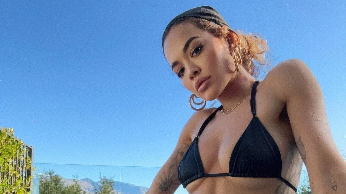 Rita Ora shows off her figure in a tiny black bikini